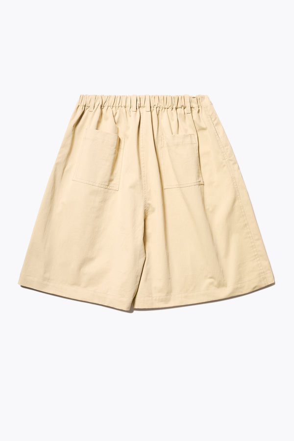 Back of The Terme Short in Sand, Relaxed and effortless wide-leg shorts with an elastic waistband, side pockets, and made from a breathable herringbone twill. Available in 5 sizes.