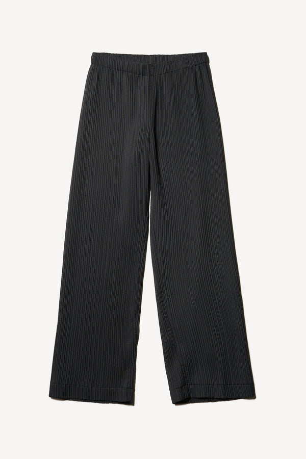 Flat Front of the black Trace Pant crafted from a recycled Japanese polyester with a relaxed straight leg and elastic waistband. 