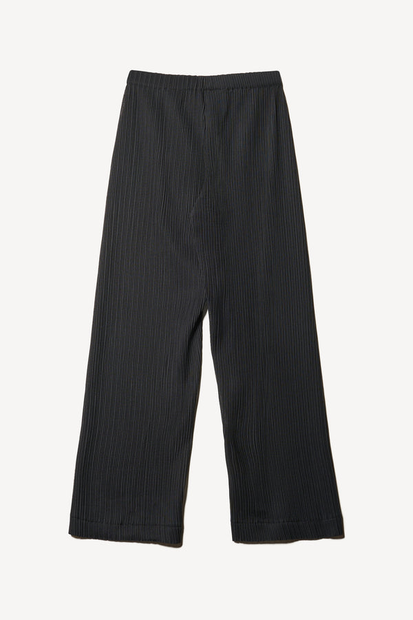 Flat back of the black Trace Pant crafted from a recycled Japanese polyester with a relaxed straight leg and elastic waistband. 