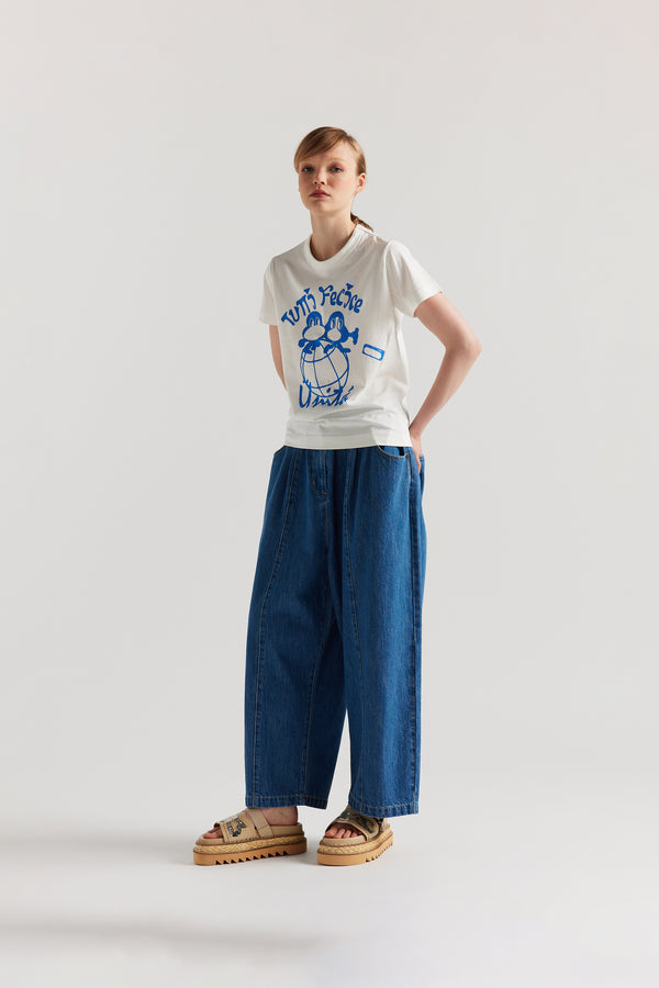 Front of model in the Off white Classic T-shirt in organic cotton jersey with Tutti Felice placement print