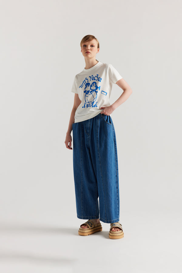 Front of model in the Off white Classic T-shirt in organic cotton jersey with Tutti Felice placement print