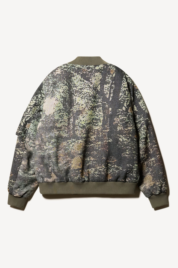 Flat Back of Unisex bomber jacket in Green Print woven jacquard with real tree camouflage, featuring dropped shoulders, ribbed trims, and full-length front zip.