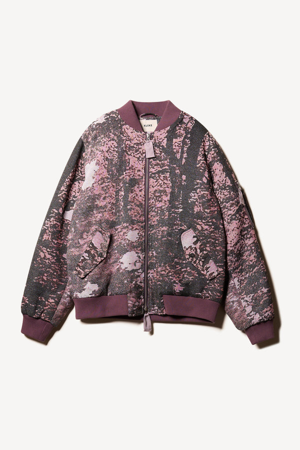 Flat Front of Unisex bomber jacket in Purple Print woven jacquard with real tree camouflage, featuring dropped shoulders, ribbed trims, and full-length front zip.