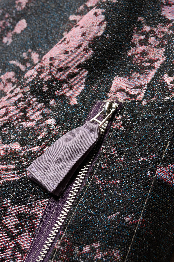 Close up fabric shot of Unisex bomber jacket in Purple Print woven jacquard with real tree camouflage, featuring dropped shoulders, ribbed trims, and full-length front zip.