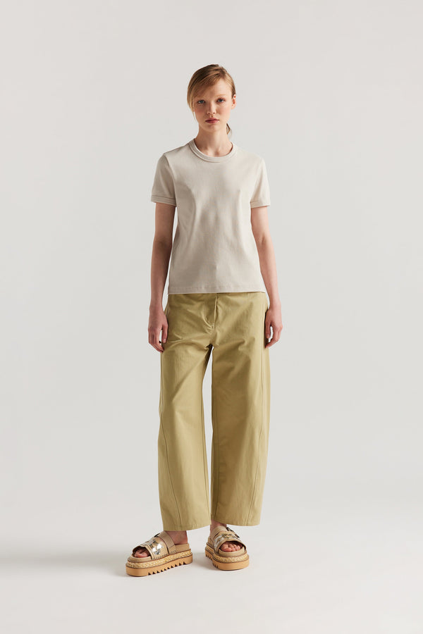 Front of Model wearing Veil slim-fit 70s-inspired ringer tee in Bone, Off White,  made from Japanese ribbed cotton.