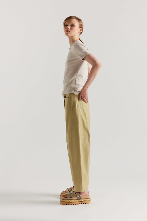 Side of Model wearing Veil slim-fit 70s-inspired ringer tee in Bone, Off White,  made from Japanese ribbed cotton.