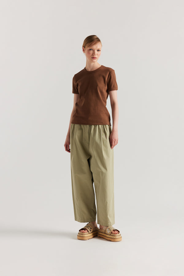 Front of Model wearing slim-fit 70s-inspired ringer tee in cocoa, made from Japanese ribbed cotton.
