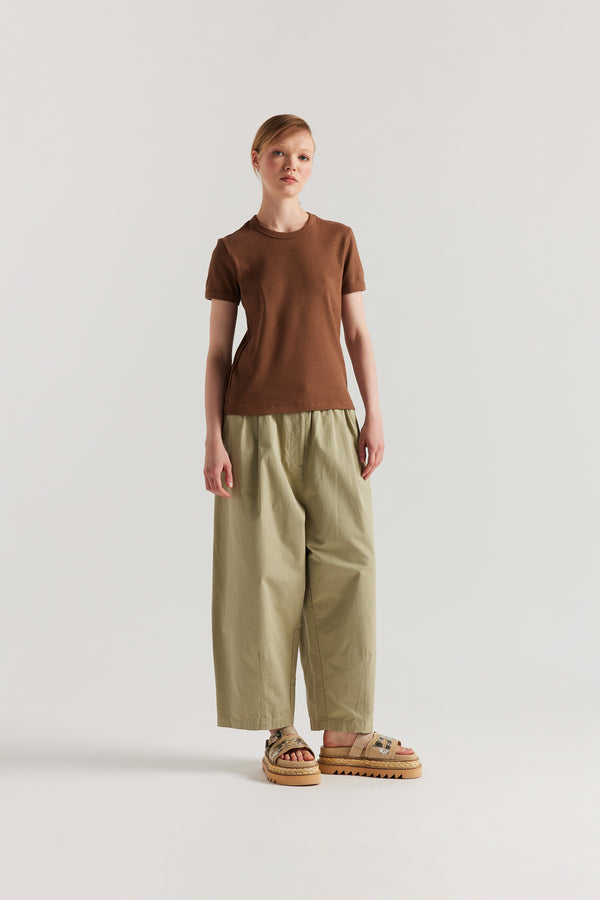 Front of Model wearing slim-fit 70s-inspired ringer tee in cocoa, made from Japanese ribbed cotton.