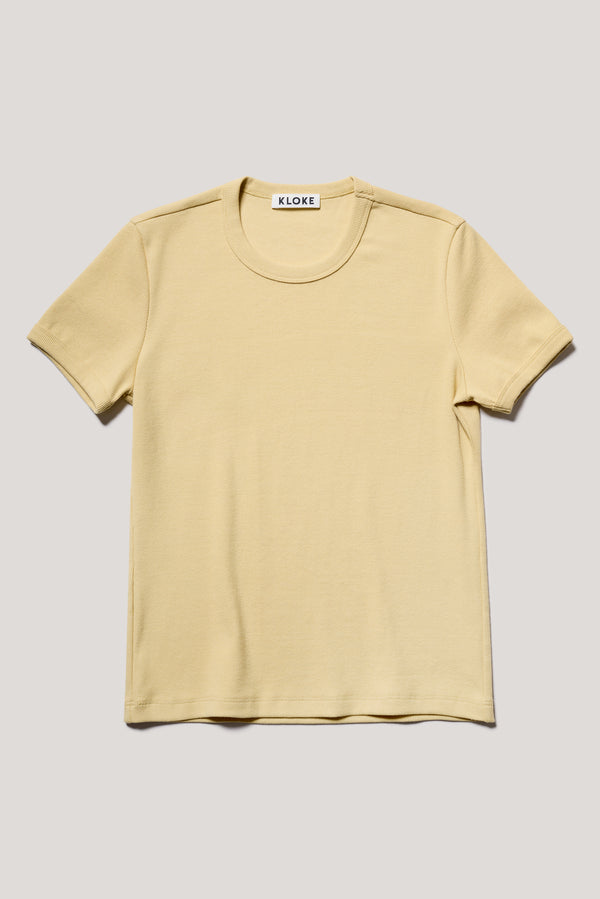 Flat front of slim-fit 70s-inspired ringer tee in Pale yellow, made from Japanese ribbed cotton.