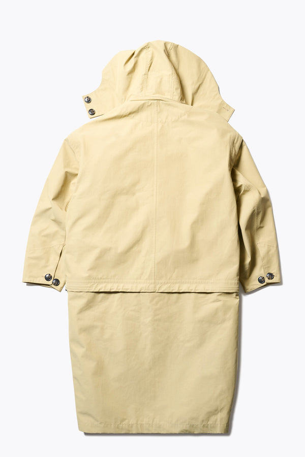 Flat Back of the Vulcan Zip Coat in Sand, an oversized, six-in-one waterproof design with zip-off sleeves and bottom, featuring 3D front pockets, a detachable hood, and a stand collar.