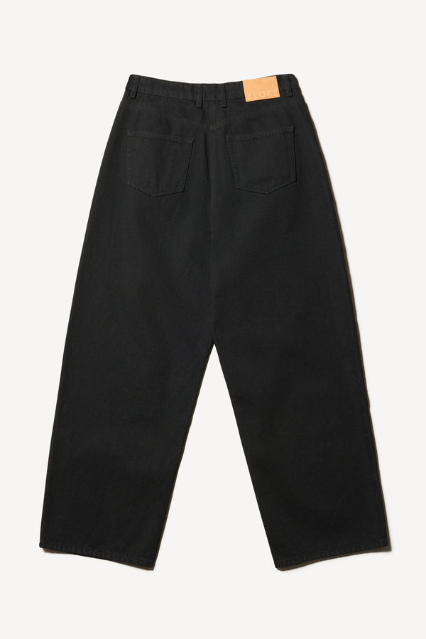 Flat back view of Kloke straight-leg jeans in black Japanese denim, featuring a mid-rise waist and relaxed silhouette