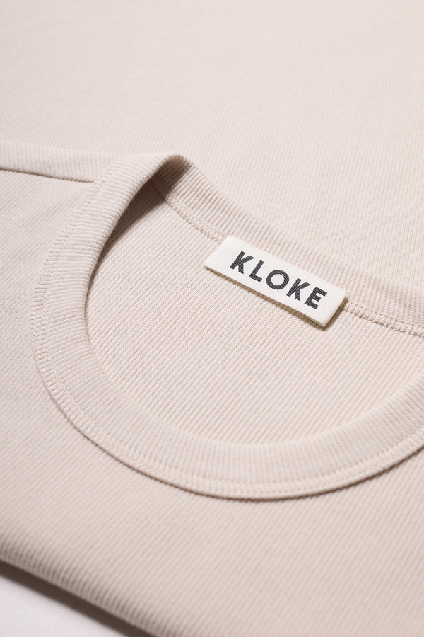 Fabric texture detail of Japanese-milled ribbed cotton Veil tee in Bone, Off White.  