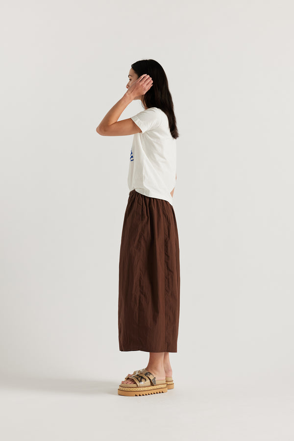 Side view of model in the KLOKE Alt K Tee in organic cotton jersey with placement print.