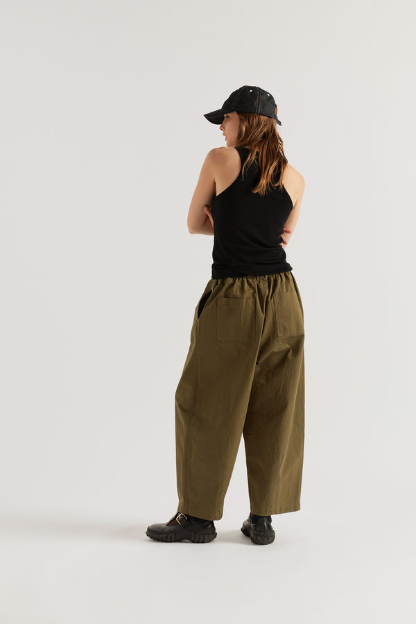 Back view of the Breaker Tank in Black showing subtle racerback cut and self-bound armholes in Japanese 1x1 organic cotton rib