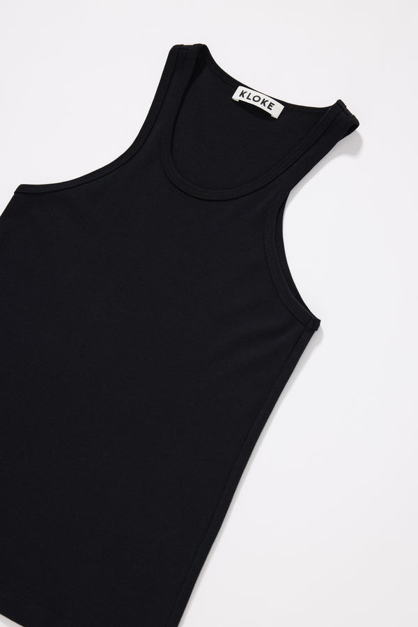 Close-up of premium Japanese 1x1 organic cotton rib texture on the Breaker Tank in Black showing shape-retaining construction
