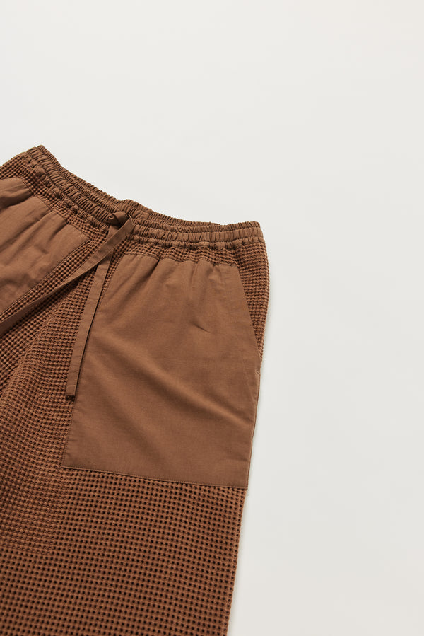 Close-up of KLOKE knit pant pockets and elasticated tie-waist