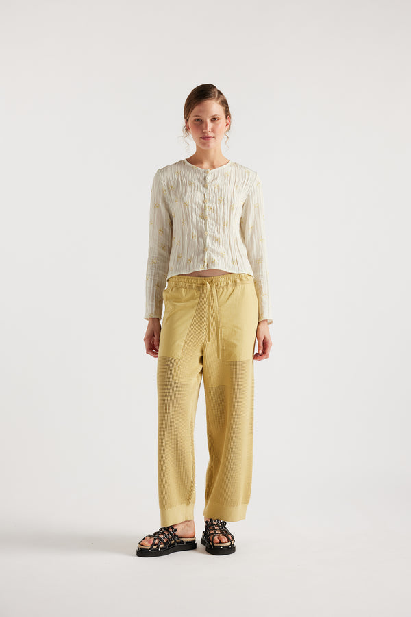 Model wears KLOKE knit pant in buttermilk, front view