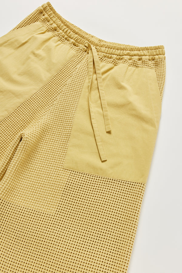 Close-up of KLOKE knit pant waistline and pockets