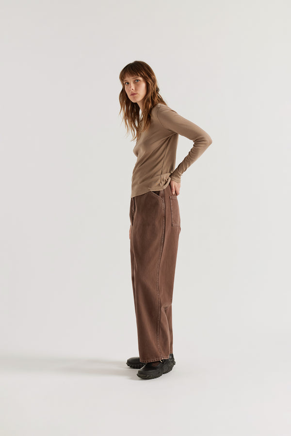 Side view of the Convex Long Sleeve Top in Fawn showing slim ribbed silhouette and 1x1 organic cotton rib texture