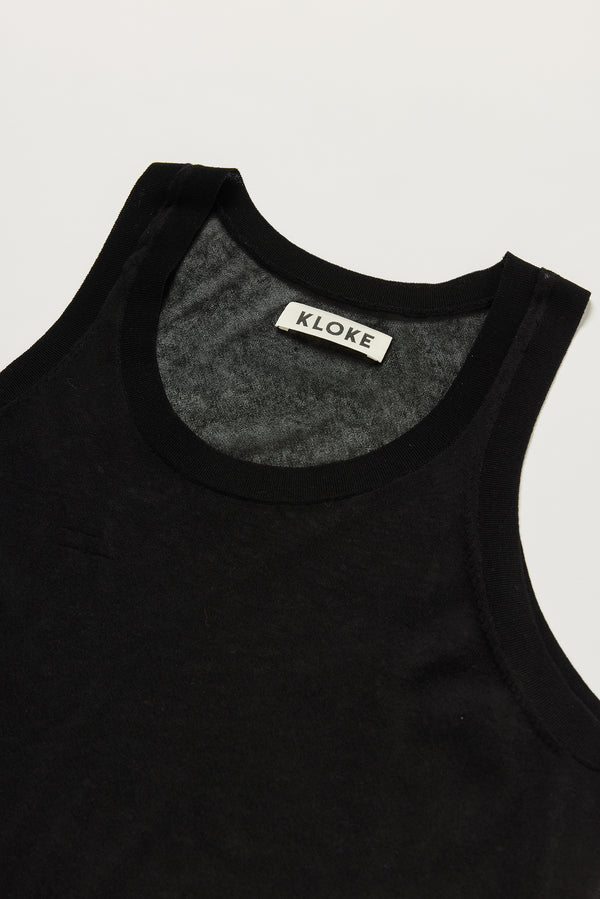 Close-up of KLOKE Direct Sheer Tank scoop neckline and rib binding