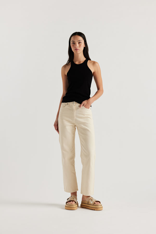 Front angle of the female model in the ecru Evade Jean in Japanese denim, featuring a straight-leg fit and slightly higher rise.