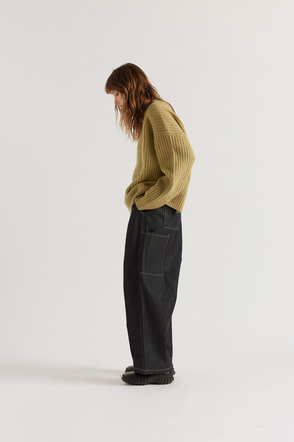 chartreuse Flutter Sweater Side view showing chunky reverse half-cardigan rib knit construction, dropped shoulders and relaxed raglan sleeve silhouette