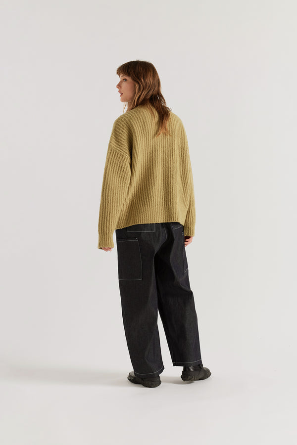chartreuse Flutter Sweater back view showing chunky reverse half-cardigan rib knit construction, dropped shoulders and relaxed raglan sleeve silhouette