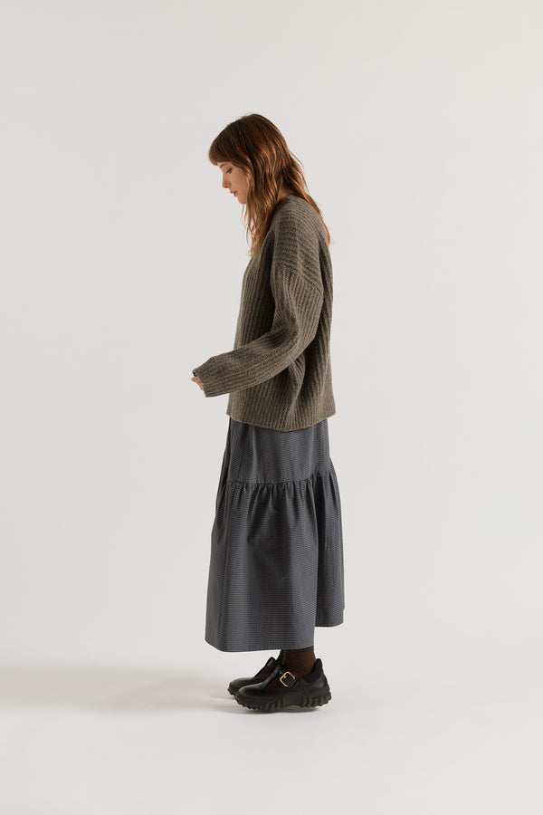 Pale Pewter  Flutter Sweater side view showing chunky reverse half-cardigan rib knit construction, dropped shoulders and relaxed raglan sleeve silhouette