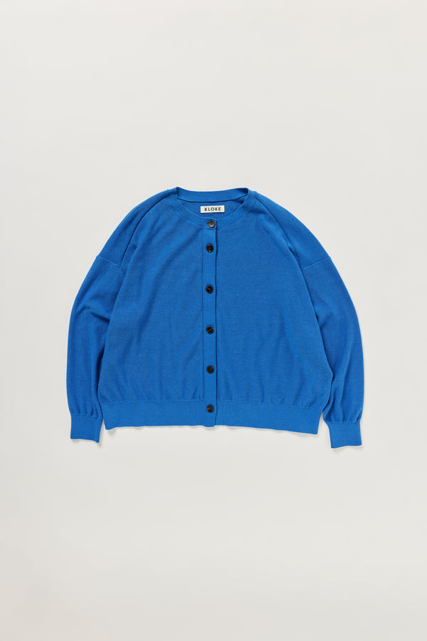 Flat lay of KLOKE cotton cardigan crew neckline and button front