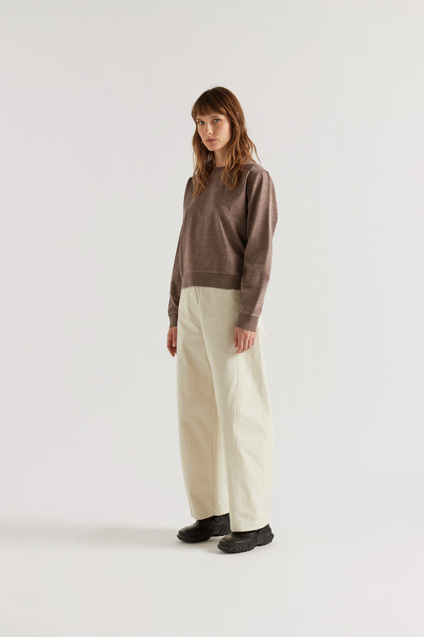 Front of the Luster Long Sleeve Top in brown pigment-dyed cotton with a relaxed cropped silhouette and dropped sleeves.