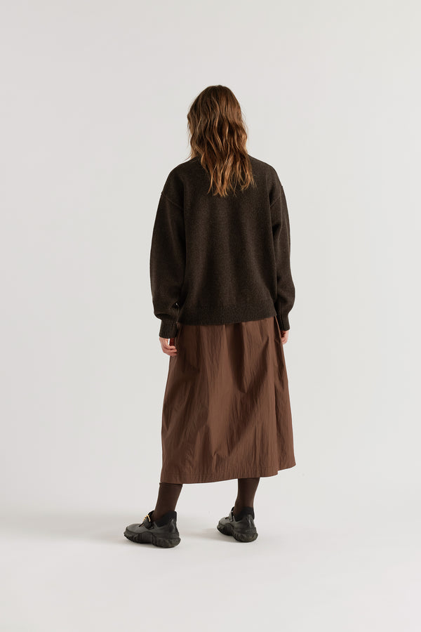 Back view of the Opal Mock Neck Sweater in Coffee showing relaxed shorter silhouette and dense structured extrafine Merino knit