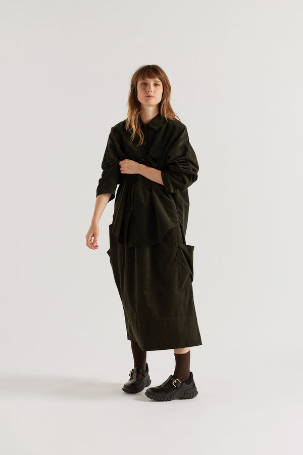 Refraction Cord Shirt in Brown worn buttoned, showing edge-stitched stand collar, dropped sleeves, front patch pockets and double over-dyed cotton corduroy