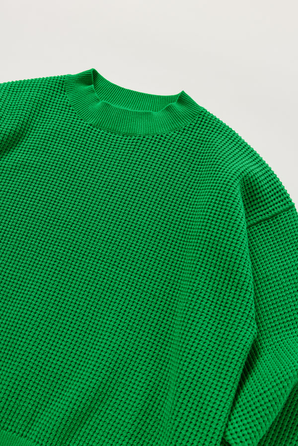 Close-up of KLOKE pointelle-knitted cotton sweater neckline