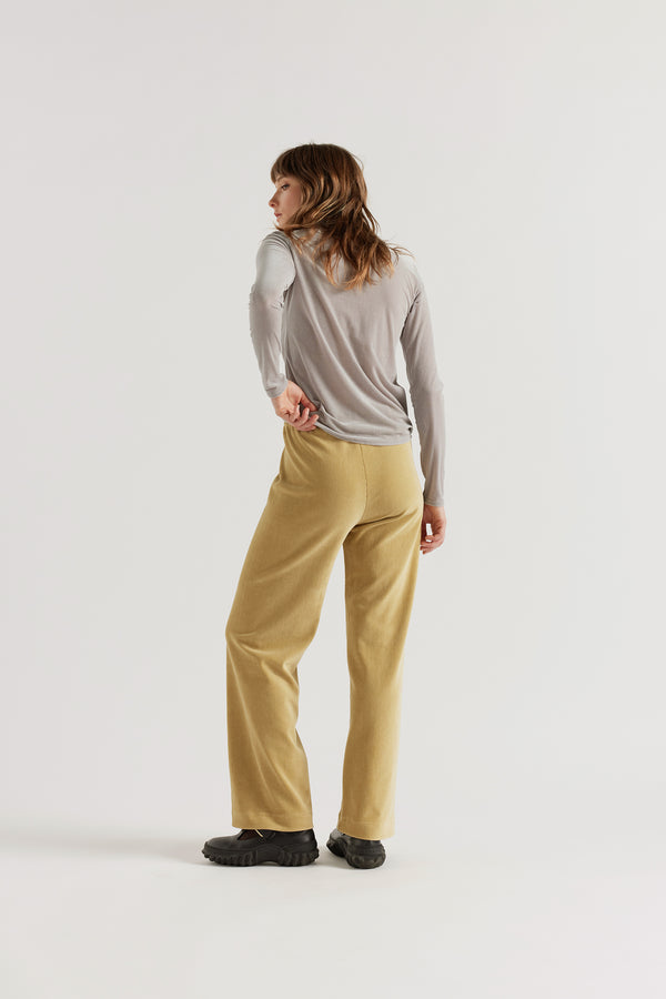 Back view of model in Sedate Lounge Pant in Yellow, relaxed-fit lounge pant in Japanese stretch corduroy velour