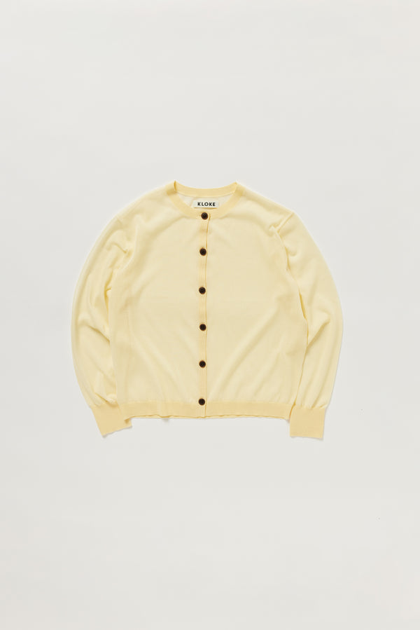 Flat lay of KLOKE sheer cardigan in pale yellow, front view