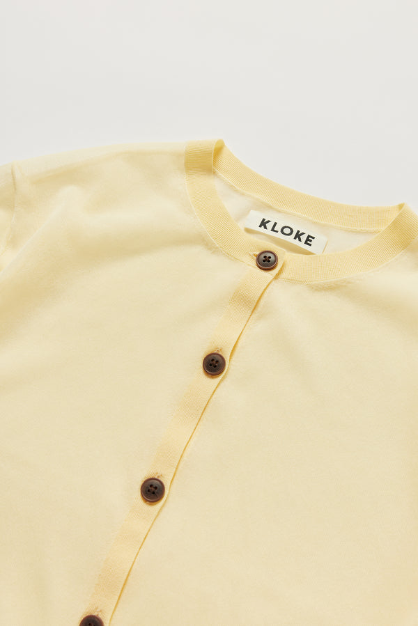 Close-up of KLOKE sheer cardigan button front and neckline