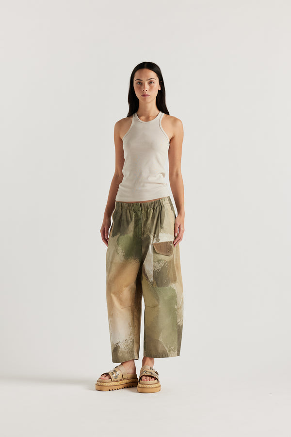Front of Model wearing the Wing tank in bone jersey. A slim-fit cotton jersey tank with a slight racer neckline. A clean, minimal silhouette