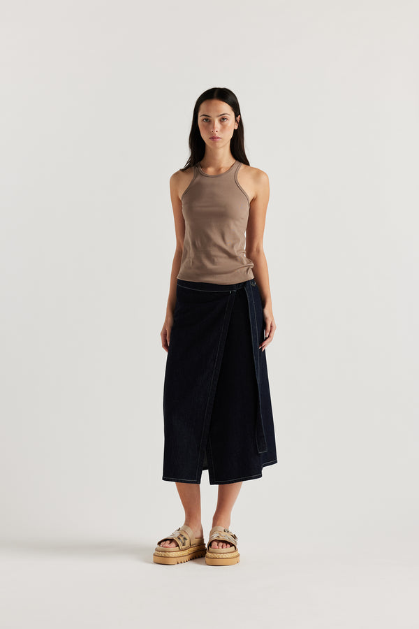 Front of Model wearing the Wing tank in fawn jersey. A slim-fit cotton jersey tank with a slight racer neckline. A clean, minimal silhouette