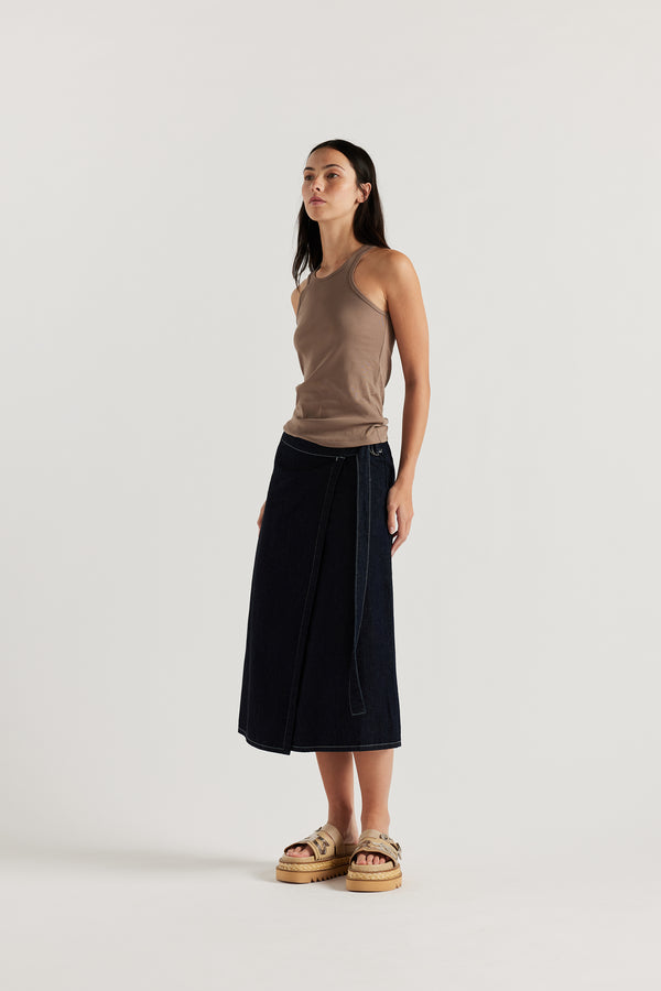 Front of Model wearing the Wing tank in fawn jersey. A slim-fit cotton jersey tank with a slight racer neckline. A clean, minimal silhouette