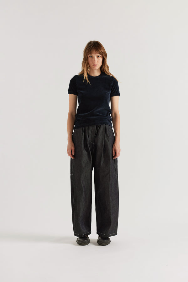 Relaxed cargo pants in dark indigo Japanese denim with a loose fit and elasticated waistband.