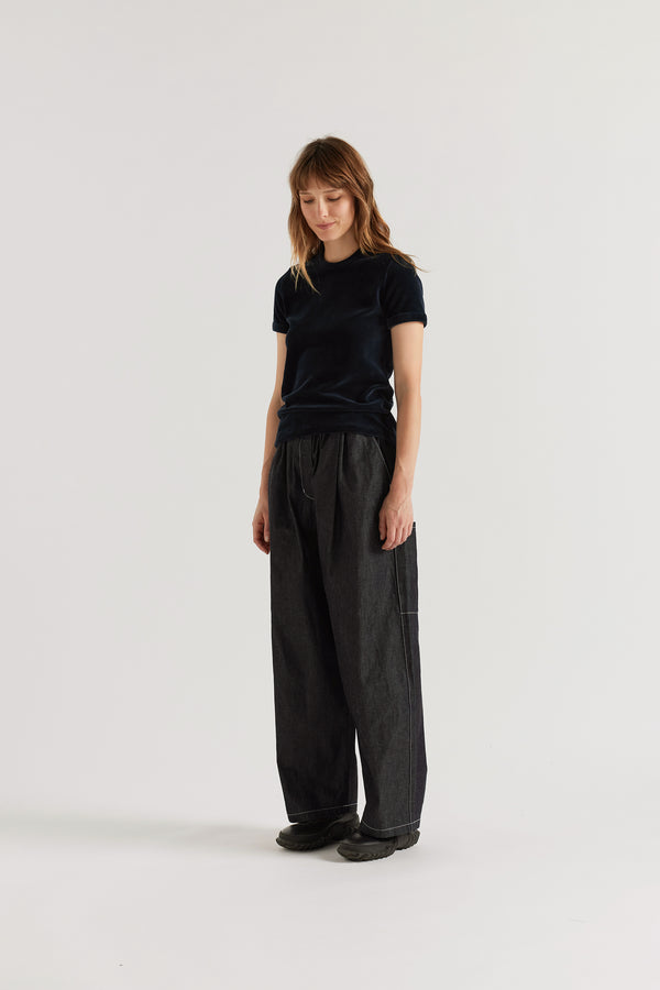 Relaxed cargo pants in dark indigo Japanese denim with a loose fit and elasticated waistband.