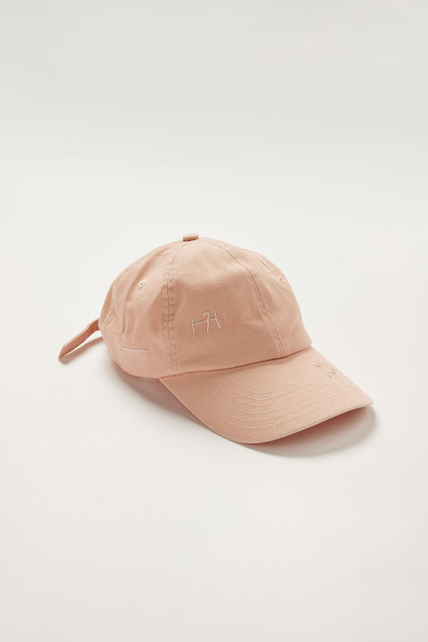 Unisex Ancient Language Cap in Pink, featuring all-over embroidered motifs inspired by Vinča markings
